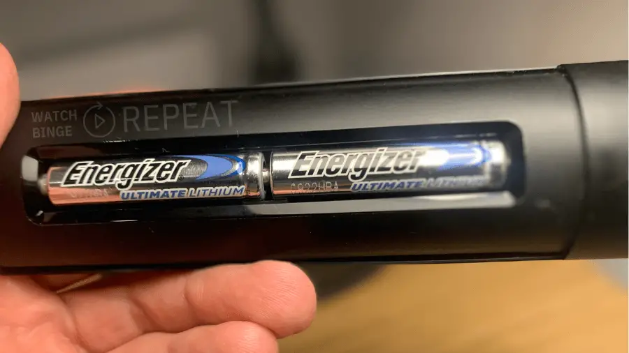 Close-up of two AA Energizer Ultimate Lithium batteries installed in a firestick remote