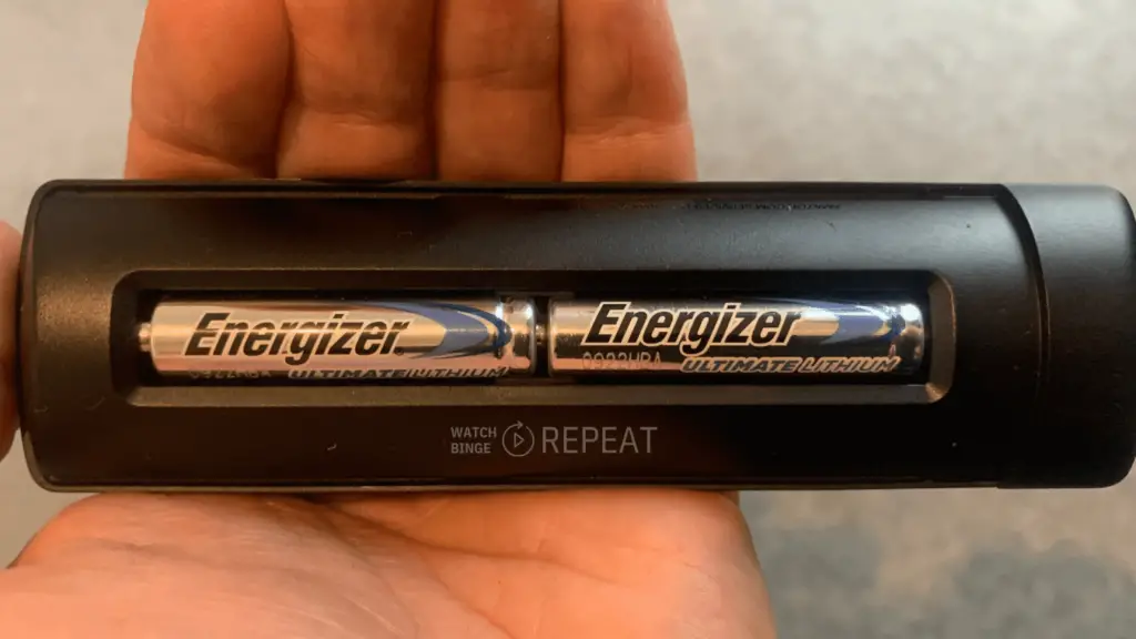 The battery compartment with two AAA Energizer ultimate lithium batteries correctly installed.