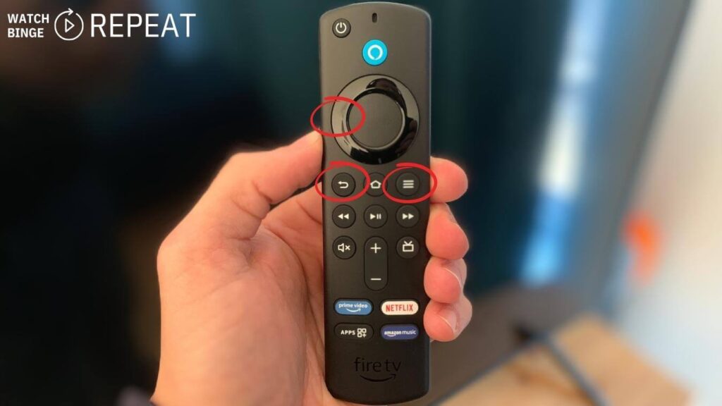 A person's hand holding a Firestick remote with two buttons circled, indicating steps to reset or troubleshoot the device. The background is blurred with subtle blue and orange hues.