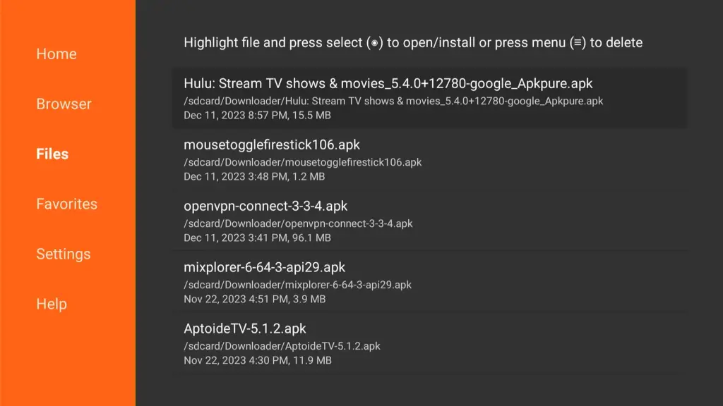 A Downloader app interface screen displaying a list of downloadable files including apps like Hulu and AptoideTV, with instructions to select a file to open/install or use the menu to delete.