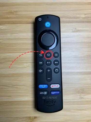 Firestick remote with Home button highlighted and pointed on with red arrow