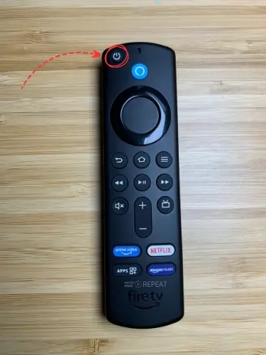 Firestick remote with Power button highlighted and pointed on with red arrow