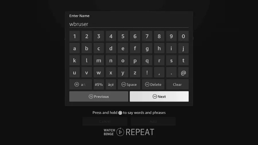 On-screen keyboard for entering a name on a Fire TV device, with the name 'wbruser' partially typed in.